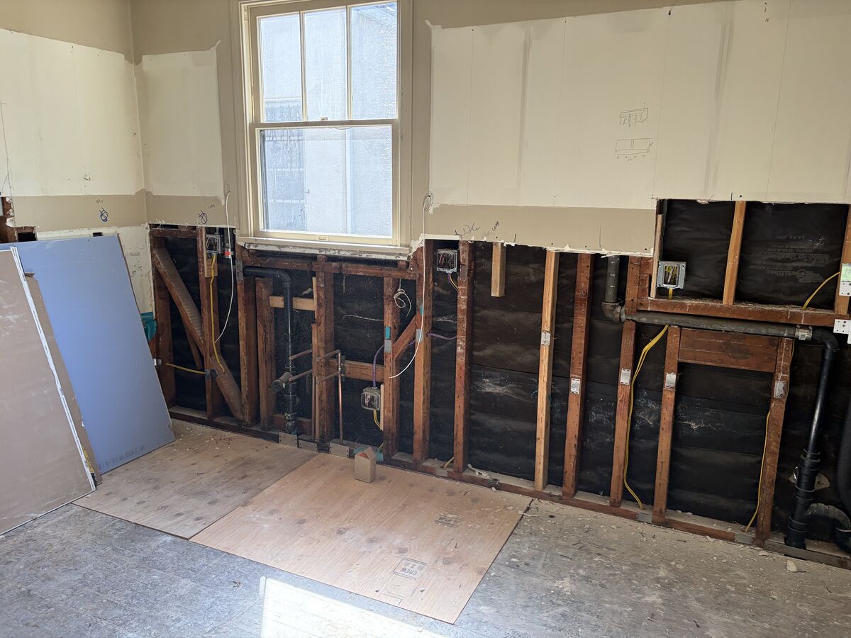 Wall in demolition with exposed framing