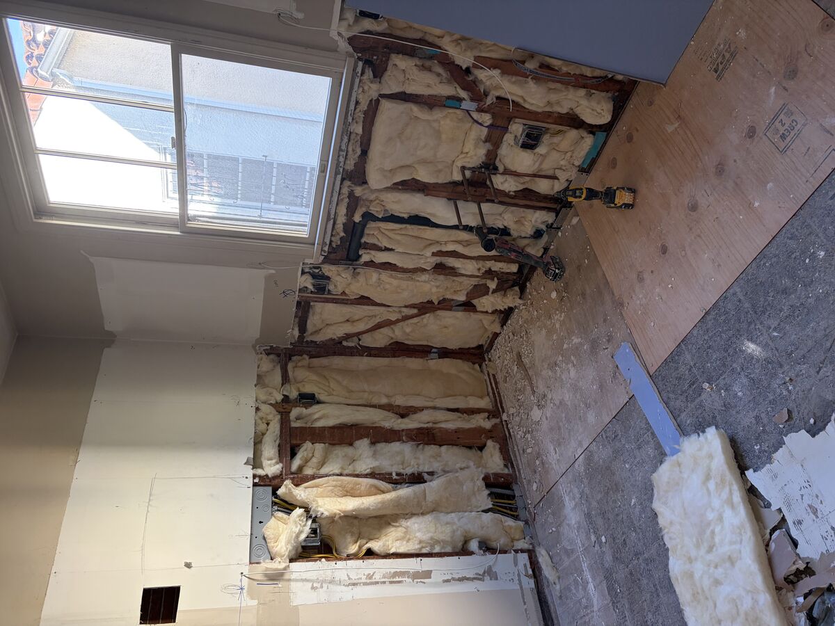 Wall with exposed insulation before drywall