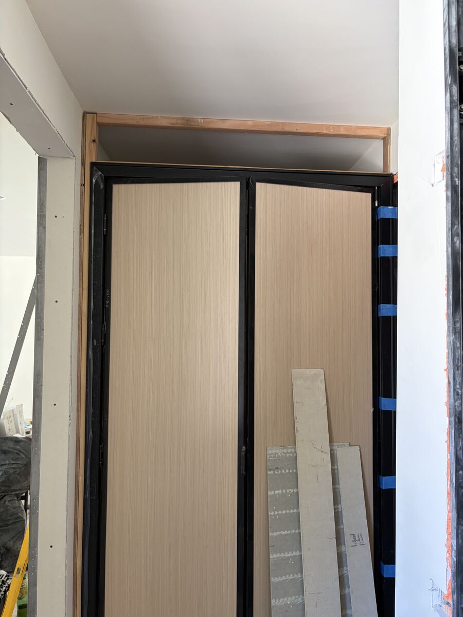 Closet with installed bi-fold doors